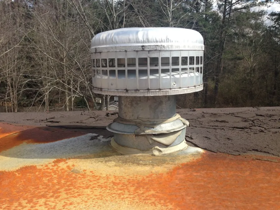 Roof turbine vent on an older low-slope roof, checked during an inspection